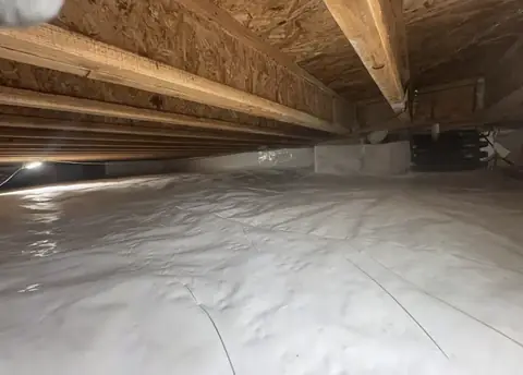 Vapor barrier installation in a Boulder, CO crawl space